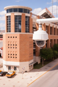 Video Security Camera Housing Mounted High on College Campus